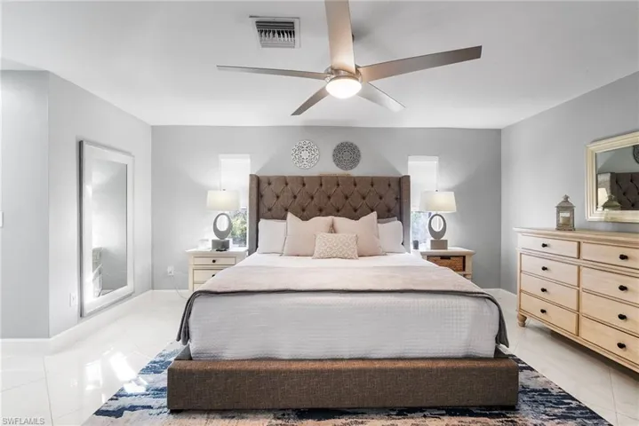 Bedroom featuring ceiling fan and light tile patterned flooring