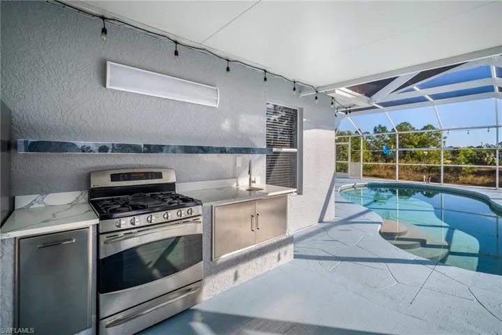 Kitchen featuring stainless steel range with gas stovetop