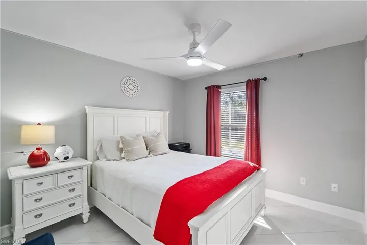 Bedroom featuring ceiling fan and light tile patterned floors