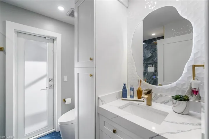 Bathroom featuring vanity and toilet