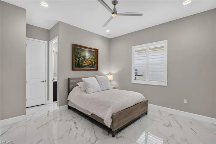 Interior room featuring large format marble-look tile flooring
