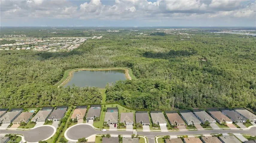 Aerial perspective showcasing a residential street with uniform single-story homes