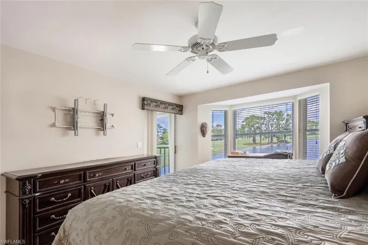 Bedroom featuring ceiling fan and access to exterior