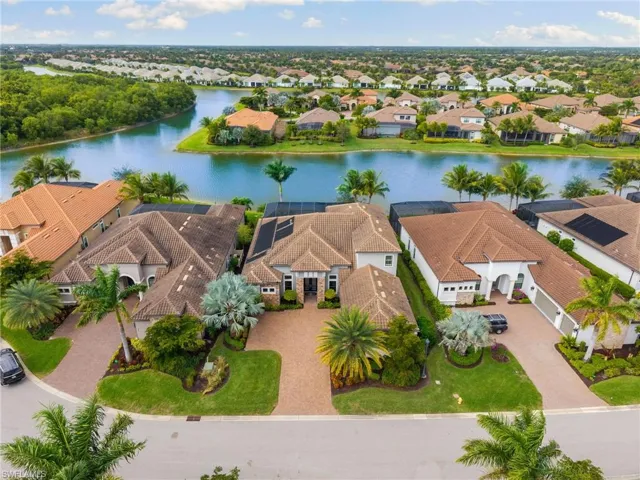 Aerial perspective of suburban area with a large body of water