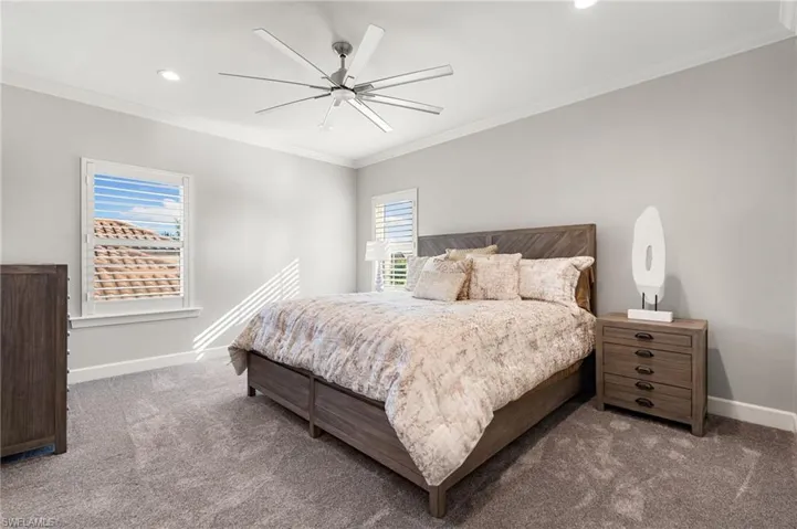 Bedroom featuring crown molding, ceiling fan, carpet, and recessed lighting