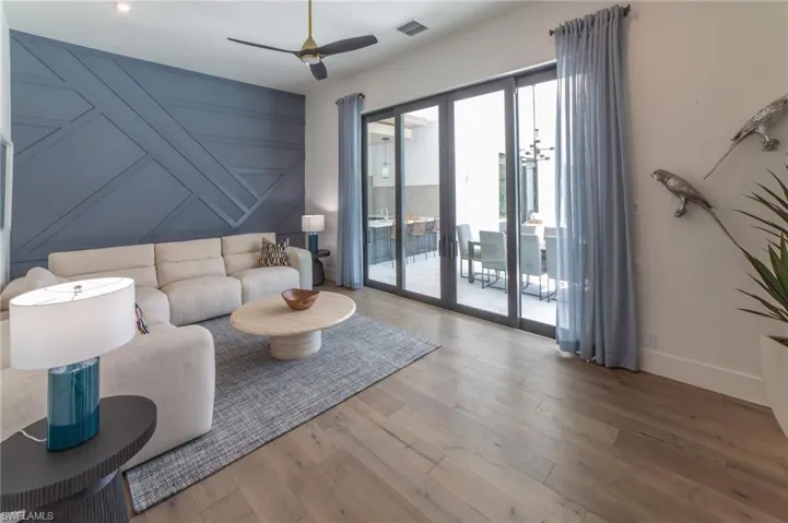 Bonus/Flex room featuring sliding doors that open to the outdoor kitchen