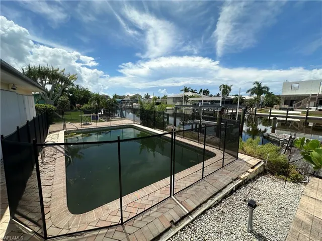Private pool with scenic canal views - Virtually Edited Image