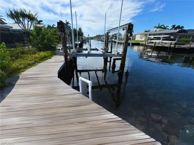 Private dock with boat life for easy waterfront access - Virtually Edited Image