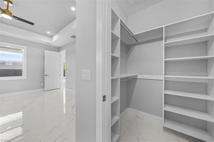 Custom built-in closet system with extensive shelving and hanging rods