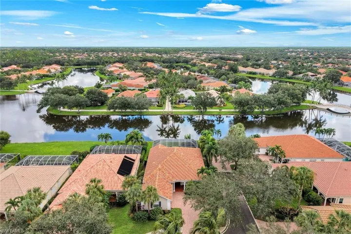 Waterfront community with mature landscaping and multiple residential structures