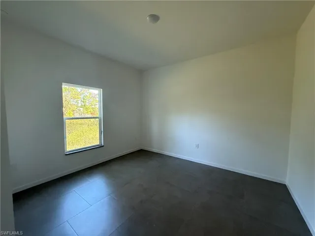 Empty room with baseboards