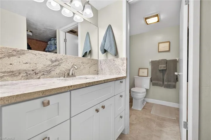 NEW M Bath cabinetry, granite countertop & backspash