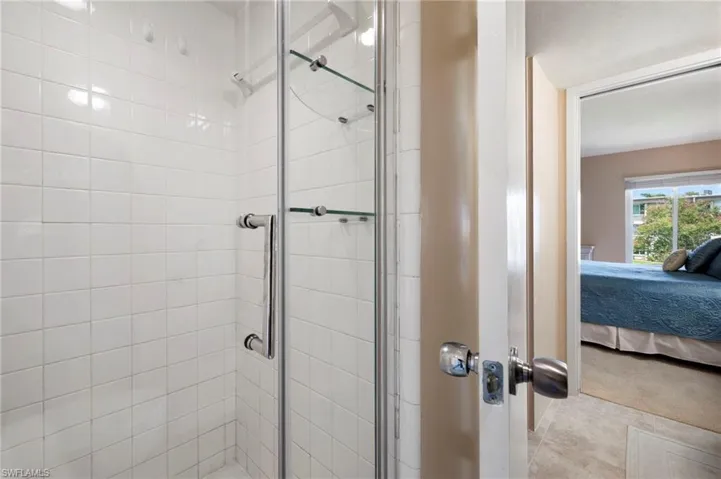 Glassed in shower in primary bedroom