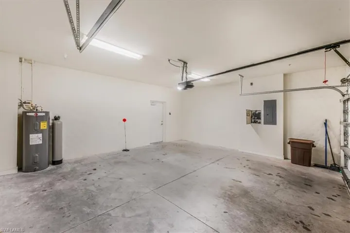 Garage with electric water heater and electric panel