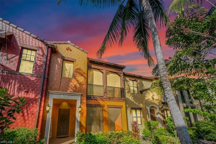 Mediterranean / spanish house featuring a balcony and stucco siding