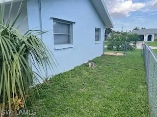 View of side of property with stucco siding