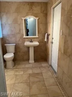 Bathroom with tile walls