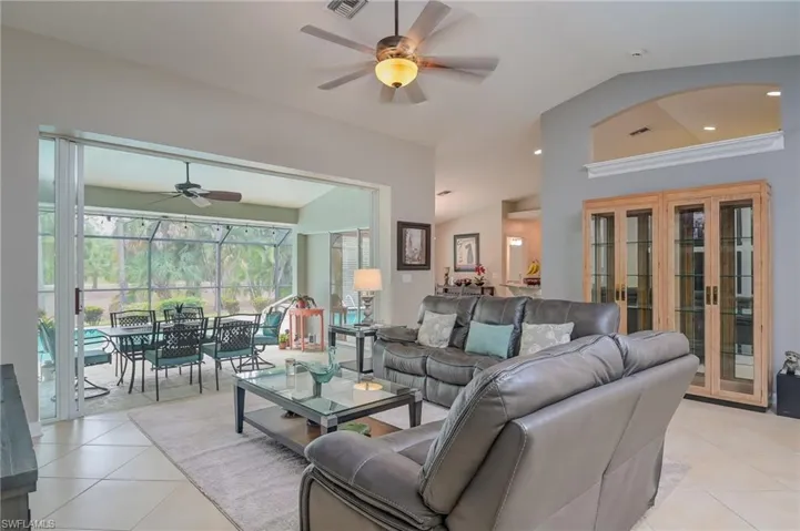Great Room w/ access to lanai dining and pool, and kitchen