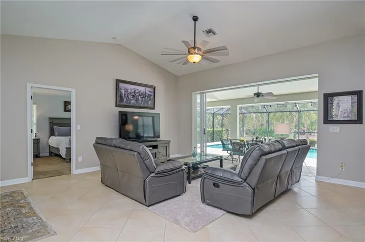 Vaulted ceiling in expansive great room showing entrance to master bedroom