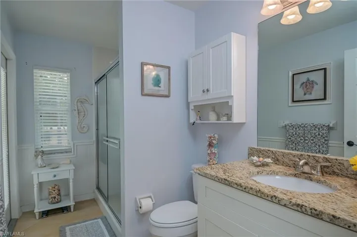 Guest bath allowing exit to pool and lanai