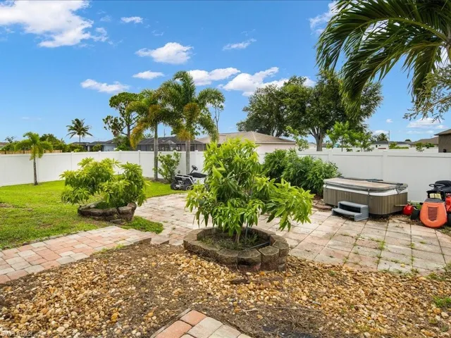 View of yard with a patio area and a hot tub