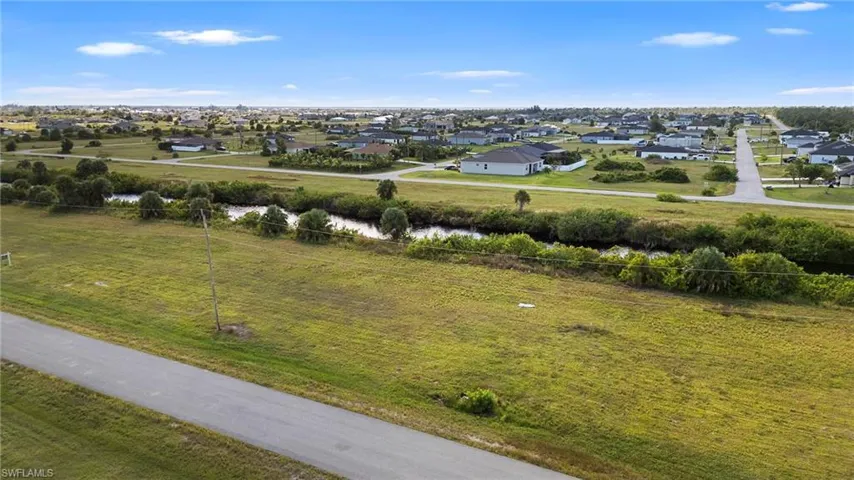 View of rural area featuring nearby suburban area