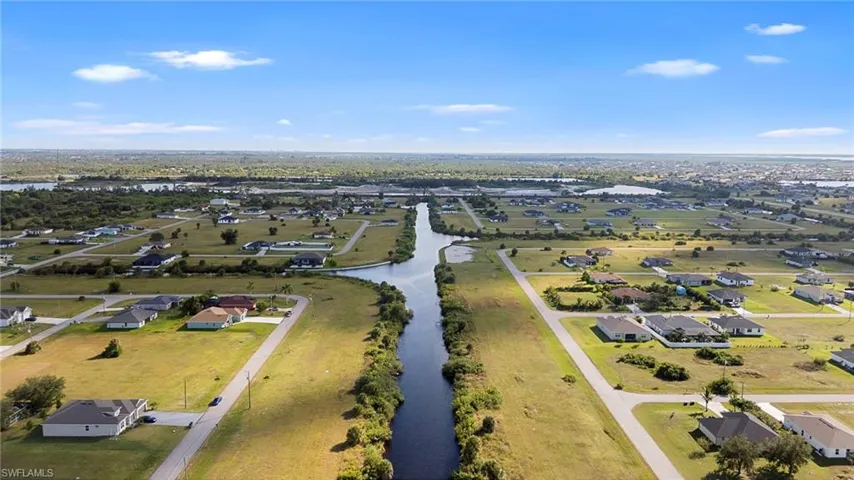 Aerial view of residential area with a nearby body of water