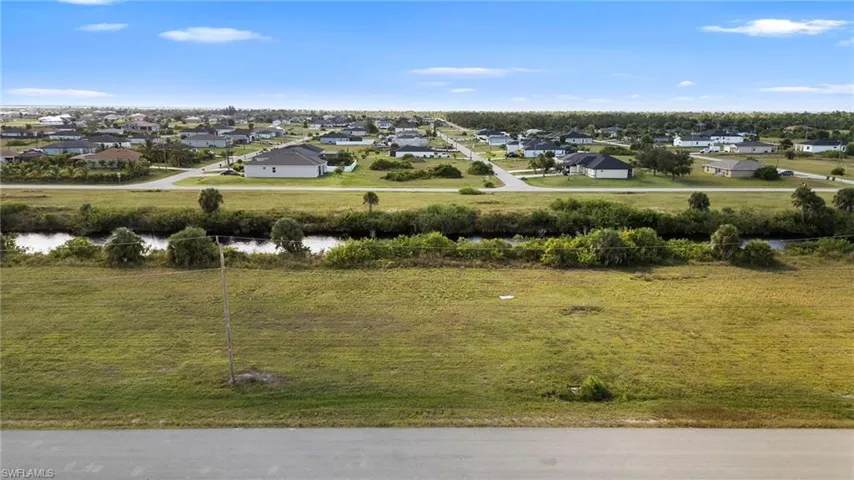 Aerial view of residential area with a large body of water