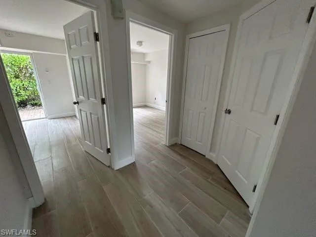 Hallway featuring light wood-type flooring