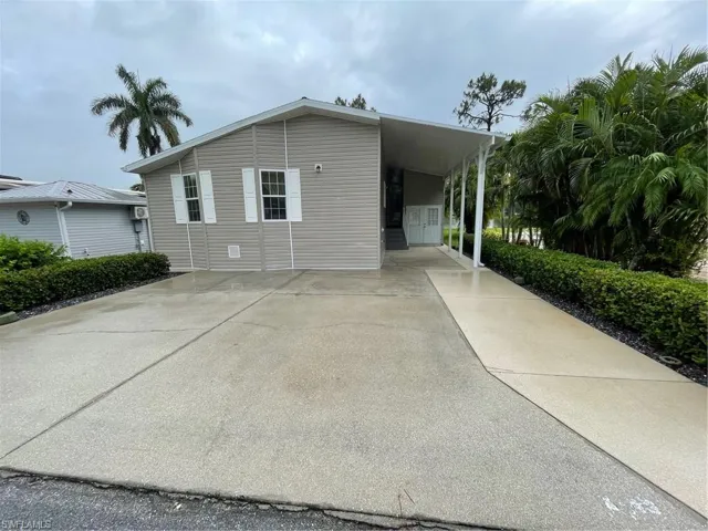 View of home's exterior featuring a carport