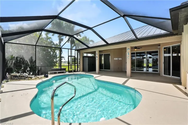 Swimming pool with a patio area and ceiling fan