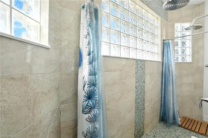 Bathroom with a tile shower