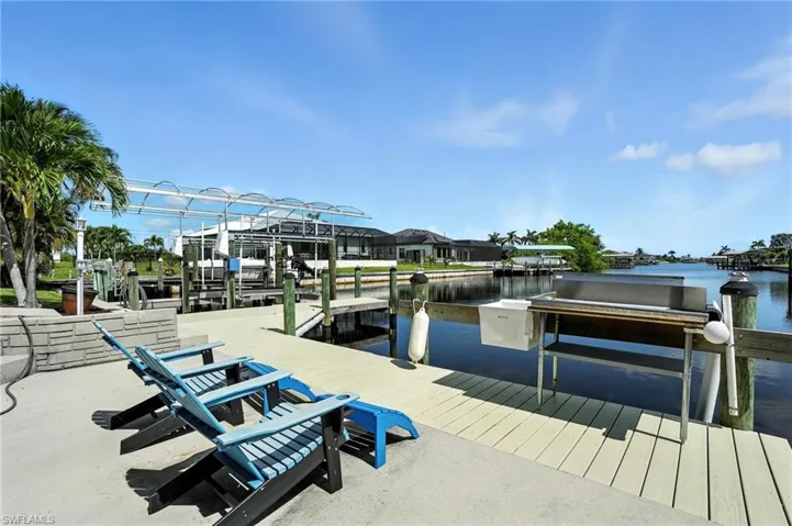 Dock with a water view and boat lift