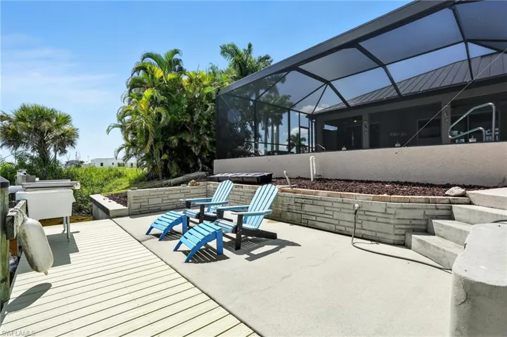 View of patio featuring glass enclosure