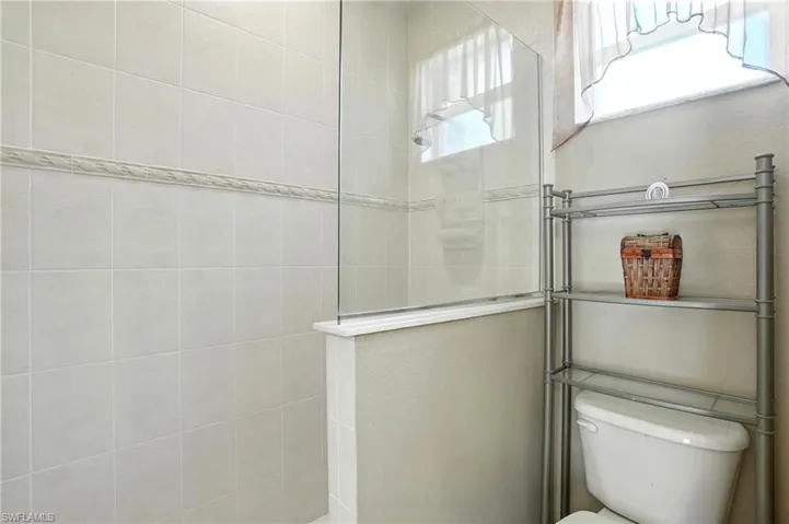 Bathroom with toilet and a walk in shower