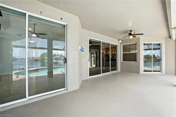View of patio with a ceiling fan