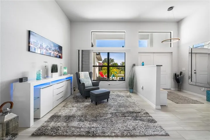 Living area with a towering ceiling