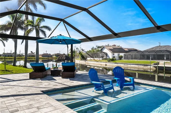 View of patio featuring a water view and a lanai