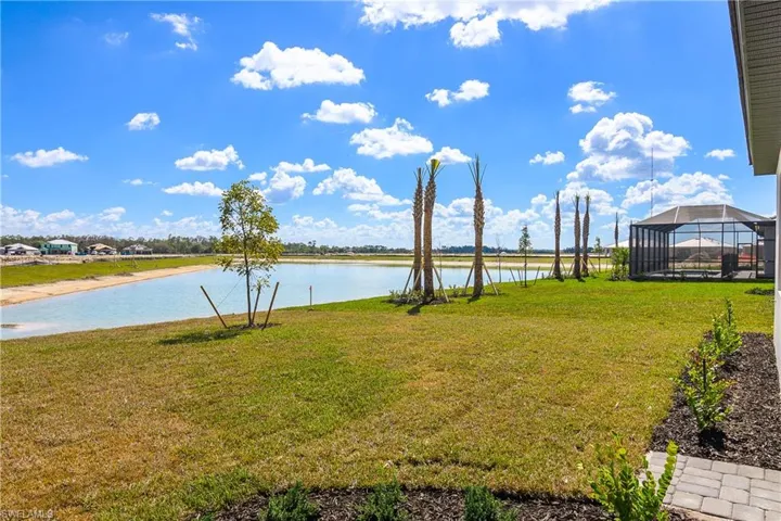 Plenty of room for your custom pool and long water views from lanai and back yard.