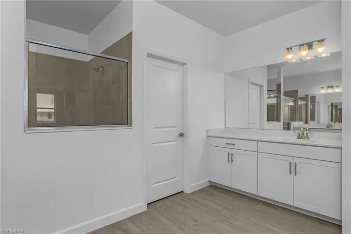Dual vanities and sinks in owner bath.