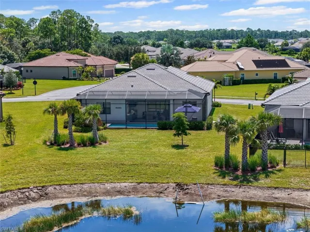 Aerial view of residential area featuring a large body of water