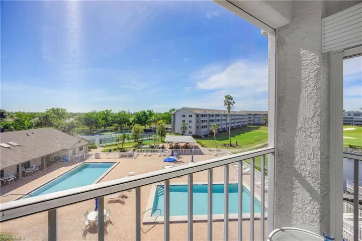Community pool with a balcony