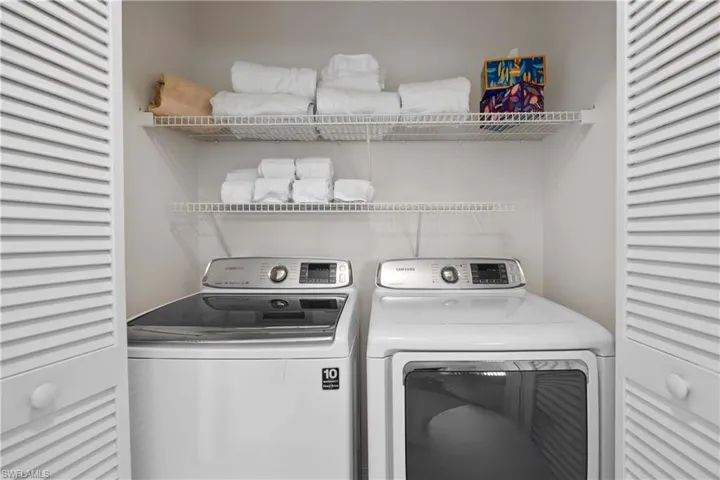 Laundry area featuring independent washer and dryer