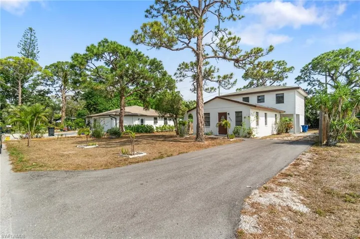 View of front of home with asphalt driveway