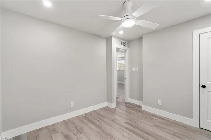 Unfurnished bedroom with recessed lighting, light wood-type flooring, baseboards, and ceiling fan