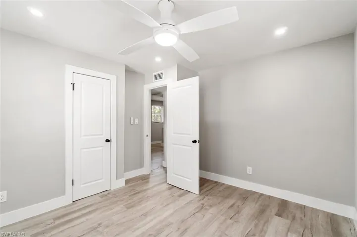 Unfurnished bedroom with baseboards, light wood-type flooring, recessed lighting, and ceiling fan