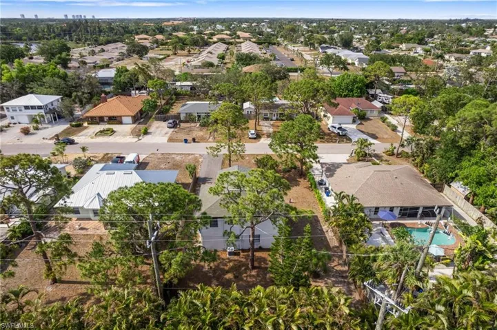 Aerial perspective of suburban area featuring a pool area
