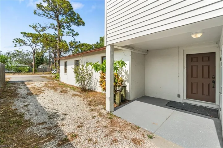 Property entrance with stucco siding