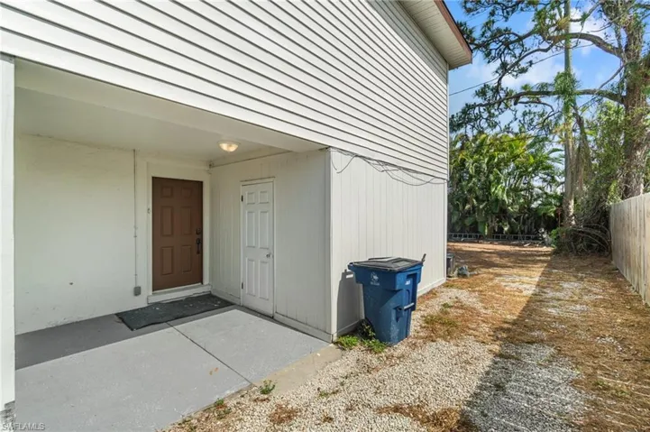 View of exterior entry with fence
