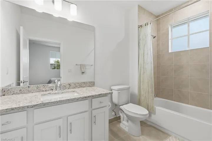 Guest ensuite bathroom with shower/tub combo.